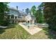 Grand estate home with a stunning pool and lush landscaping at 4787 Northside Dr, Atlanta, GA 30327