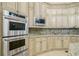 Kitchen features double ovens, microwave, and granite countertops at 4787 Northside Dr, Atlanta, GA 30327