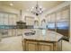 Gourmet kitchen with large island, stainless steel appliances, and custom cabinetry at 4787 Northside Dr, Atlanta, GA 30327