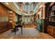 Impressive library with fireplace, built-in bookshelves, and spiral staircase at 4787 Northside Dr, Atlanta, GA 30327