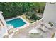 Inviting pool area with lounge seating and a beautiful backyard view at 4787 Northside Dr, Atlanta, GA 30327