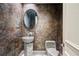 Elegant powder room with stone sink and textured walls at 4787 Northside Dr, Atlanta, GA 30327