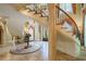 Double staircase with ornate railing in a spacious entryway at 4787 Northside Dr, Atlanta, GA 30327