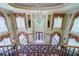 Grand staircase with wrought iron railing and chandelier at 4787 Northside Dr, Atlanta, GA 30327