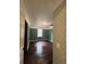 Cozy bedroom showcasing hardwood floors, crown molding, and a leaf patterned accent wall at 54 Cross Branches, Acworth, GA 30101