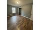 Bedroom featuring vinyl floors, neutral paint, a closet and a window letting in natural light at 54 Cross Branches, Acworth, GA 30101