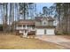 Charming two-story home with a well-manicured front yard and attached two-car garage at 54 Cross Branches, Acworth, GA 30101