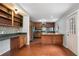 Kitchen with wooden cabinets, stainless steel appliances, and tile floors at 54 Cross Branches, Acworth, GA 30101