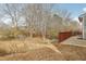 View of backyard from patio, showing trees and lawn at 1236 Key Manor Ln, Lawrenceville, GA 30045