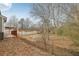 A view of a backyard with trees and a fence at 1236 Key Manor Ln, Lawrenceville, GA 30045