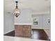 Bright dining room with hardwood floors and brick accent wall at 2505 Mellville Ave, Decatur, GA 30032