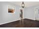 Dining room with dark hardwood floors and kitchen view at 2505 Mellville Ave, Decatur, GA 30032