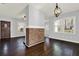 Bright dining room with hardwood floors and brick accent wall at 2505 Mellville Ave, Decatur, GA 30032