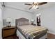 Comfortable bedroom with hardwood floors, ceiling fan, lamps, and closet at 395 Pharr Ne Rd # 207, Atlanta, GA 30305