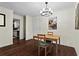 Cozy dining area with modern chandelier and hardwood floors at 395 Pharr Ne Rd # 207, Atlanta, GA 30305