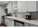 Efficient kitchen with stainless steel appliances, white cabinets, and a modern faucet at 395 Pharr Ne Rd # 207, Atlanta, GA 30305