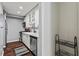Galley kitchen with stainless appliances, white cabinetry, and hardwood flooring at 395 Pharr Ne Rd # 207, Atlanta, GA 30305