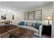 Comfortable living room featuring a plush sofa, accent pillows, and a unique wood coffee table at 395 Pharr Ne Rd # 207, Atlanta, GA 30305