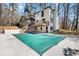 Expansive backyard with a large inground pool, spacious patio, and lush landscaping at 7110 Brandon Mill, Sandy Springs, GA 30328