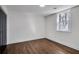 Bright, empty bedroom with wood floors, closet and a window with wooded view at 7110 Brandon Mill, Sandy Springs, GA 30328