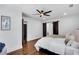 This bedroom offers recessed lighting, a ceiling fan and sliding barn doors at 7110 Brandon Mill, Sandy Springs, GA 30328