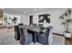 Elegant dining room with modern art, stylish seating for six, and bright lighting at 7110 Brandon Mill, Sandy Springs, GA 30328