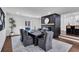 Dining room featuring an elegant fireplace, decor, and access to the kitchen and other living spaces at 7110 Brandon Mill, Sandy Springs, GA 30328