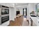 Contemporary kitchen with stainless steel double oven and white cabinetry at 7110 Brandon Mill, Sandy Springs, GA 30328