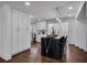 Modern kitchen featuring white cabinets, a black marble island, and stainless steel appliances at 7110 Brandon Mill, Sandy Springs, GA 30328