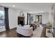 Inviting living room with a fireplace, neutral decor, and access to a deck through glass doors at 7110 Brandon Mill, Sandy Springs, GA 30328