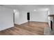 Bright living room with wood-look floors and a fireplace adds warmth and character at 7110 Brandon Mill, Sandy Springs, GA 30328