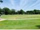 Large athletic field with goalposts and playground in background at 1054 Ira Sw St, Atlanta, GA 30310