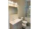 Updated bathroom with gray vanity and marble shower/tub combo at 1054 Ira Sw St, Atlanta, GA 30310