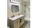 Modern bathroom with double vanity and marble shower at 1054 Ira Sw St, Atlanta, GA 30310