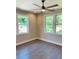 Well-lit bedroom with hardwood floors and ceiling fan at 1054 Ira Sw St, Atlanta, GA 30310