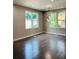 Spacious living room featuring hardwood floors and large windows at 1054 Ira Sw St, Atlanta, GA 30310