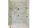 Luxurious shower with marble tile and rainfall shower heads at 1054 Ira Sw St, Atlanta, GA 30310