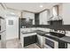 Modern kitchen with stainless steel appliances and dark cabinetry at 11 Peyton Sw Pl, Atlanta, GA 30311