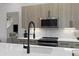 Modern kitchen with stainless steel appliances and white quartz countertops at 2036 Bixby Byway Se Dr, Atlanta, GA 30317