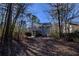 Backyard of home featuring mature trees and multi-level deck at 3640 Autumn View Nw Dr, Acworth, GA 30101