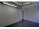 Finished basement area with gray floor and white walls adjacent to unfinished area at 3640 Autumn View Nw Dr, Acworth, GA 30101