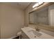 Bathroom with a vanity, sink, mirror, toilet, and marble-walled shower at 3640 Autumn View Nw Dr, Acworth, GA 30101