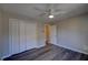 Bedroom featuring a ceiling fan and a closet with white bi-fold doors at 3640 Autumn View Nw Dr, Acworth, GA 30101