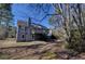 Exterior view of house, featuring a wood deck and a walkout basement at 3640 Autumn View Nw Dr, Acworth, GA 30101
