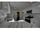 Well-designed kitchen with white cabinets, stainless steel appliances, and attractive backsplash at 3640 Autumn View Nw Dr, Acworth, GA 30101