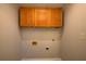 Bare laundry room featuring upper cabinets and hook-ups ready for a washer and dryer at 3640 Autumn View Nw Dr, Acworth, GA 30101