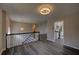 Upstairs living room features hardwood floors, neutral walls, and access to the kitchen at 3640 Autumn View Nw Dr, Acworth, GA 30101