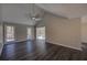 Spacious living room with dark wood floors and large windows offering plenty of natural light at 3640 Autumn View Nw Dr, Acworth, GA 30101