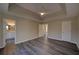 Spacious main bedroom features a tray ceiling, a ceiling fan, and wood-look flooring at 3640 Autumn View Nw Dr, Acworth, GA 30101