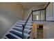A staircase with hardwood steps and white risers leads to the upper level of the home at 3640 Autumn View Nw Dr, Acworth, GA 30101